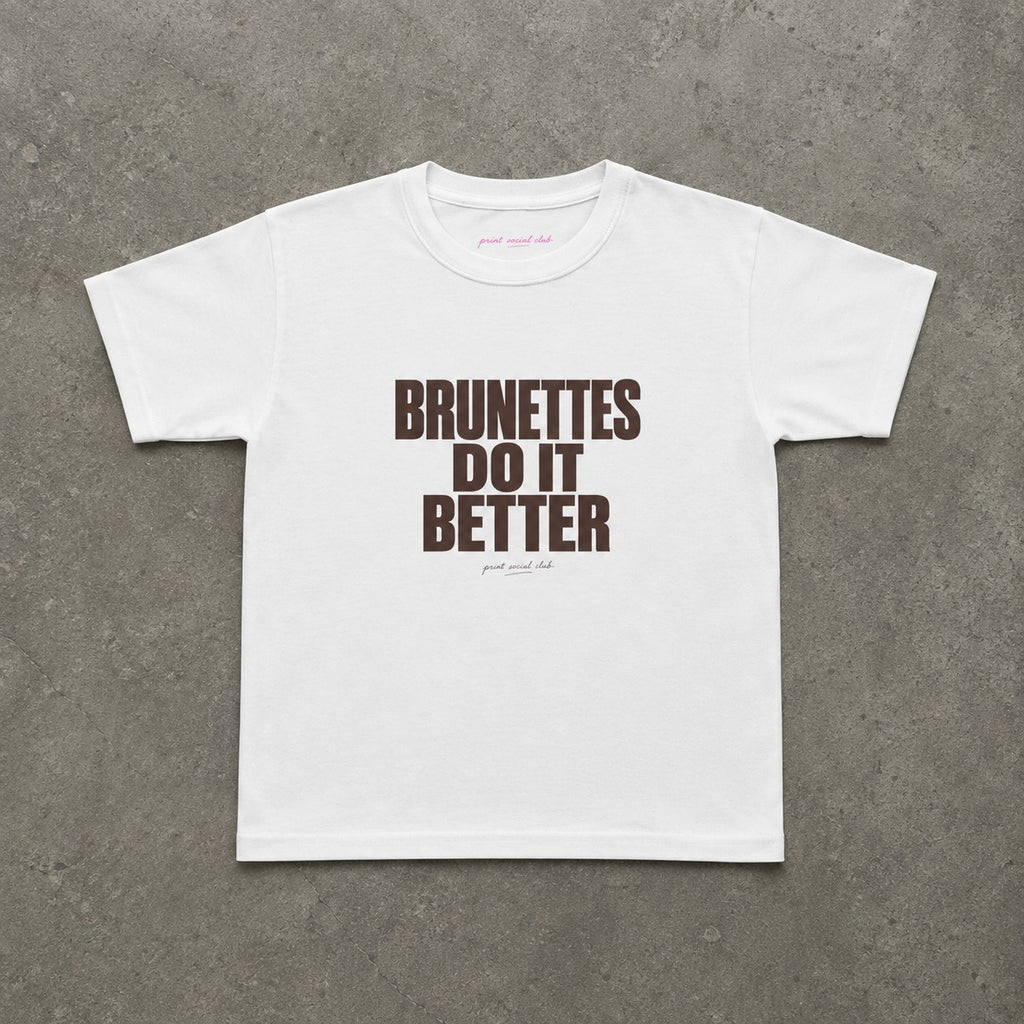 Brunettes Do It Better Baby Tee in White, flat lay