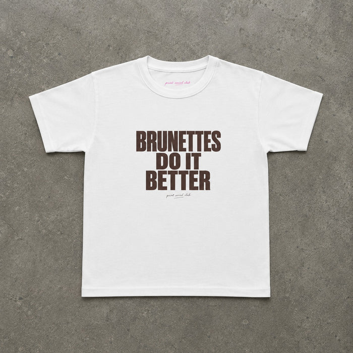 Brunettes Do It Better Baby Tee in White, flat lay