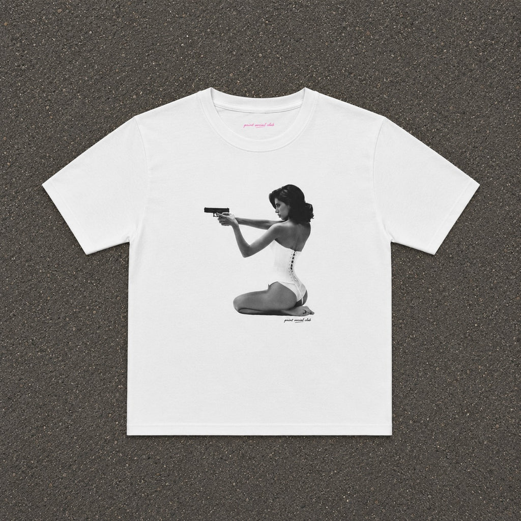 Hands-Up Baby Tee in white, flat lay with a black and white kneeling figure print