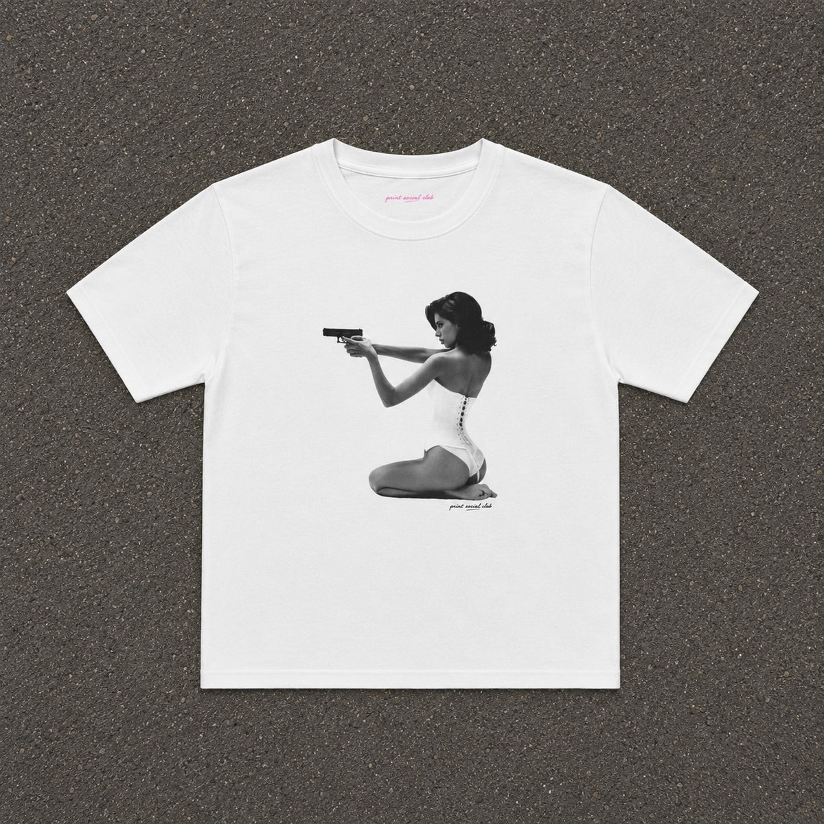 Hands-Up Baby Tee in white, flat lay with a black and white kneeling figure print
