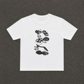Heels Baby Tee in white, flat lay with a black and white stack of heels print