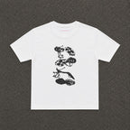 Heels Baby Tee in white, flat lay with a black and white stack of heels print