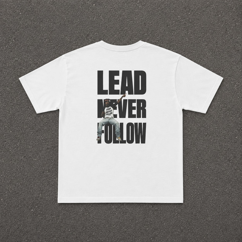 LNF Baby Tee in white, flat lay of the back with the Lead Never Follow print
