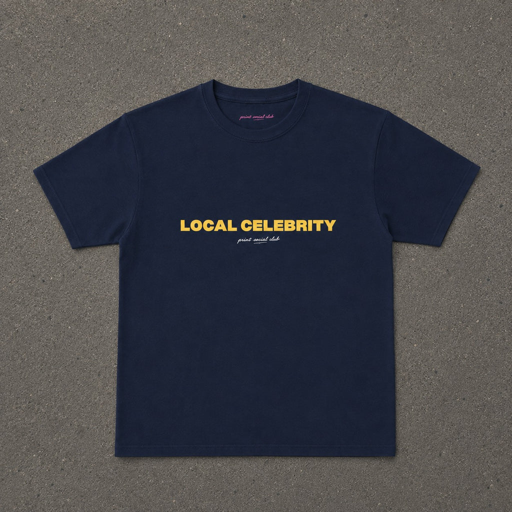 Local Celebrity Baby Tee in Navy, flat lay