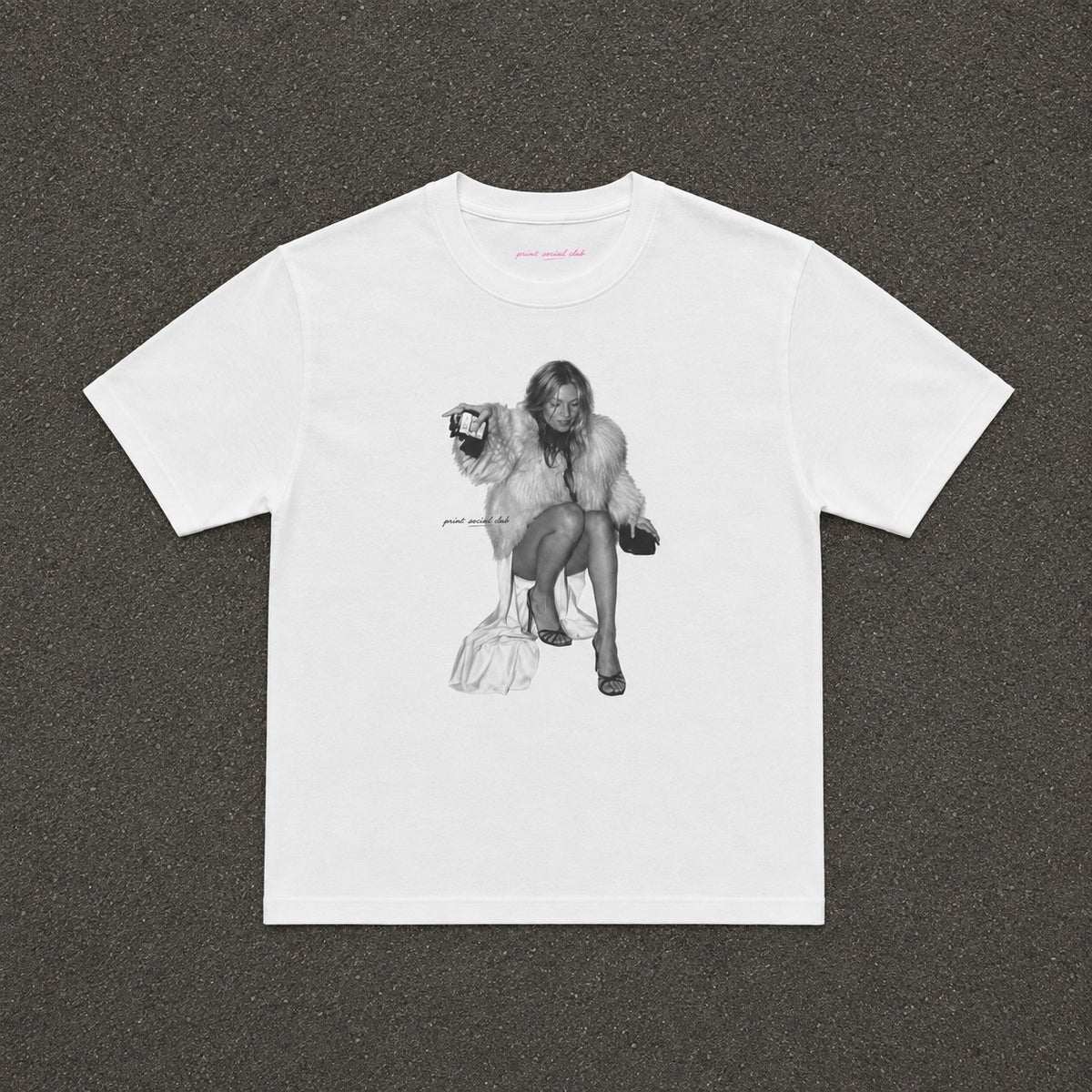 Moss Baby Tee in white, flat lay with a black and white fur coat portrait print