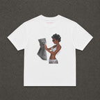 News Baby Tee in white, flat lay with a black and white newspaper reader print