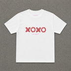 XOXO Baby Tee in White, flat lay